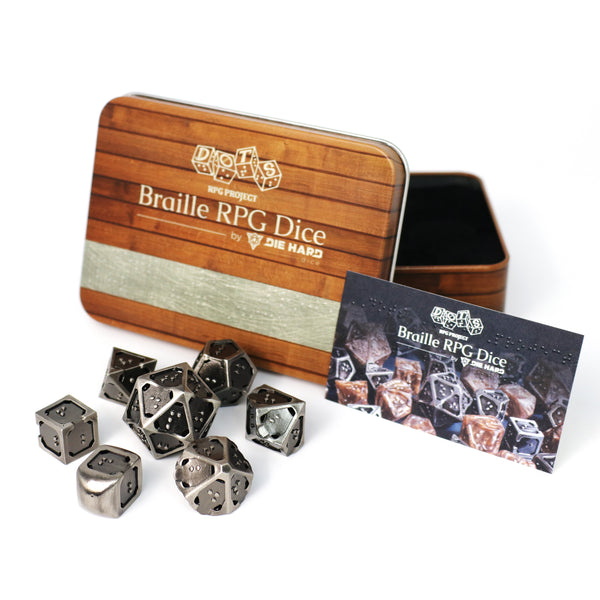 7 piece set of hollow metal braille rpg dice in silver ingot with metal case and sighted braille guide.