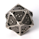 Closeup of hollow metal d20 in silver ingot